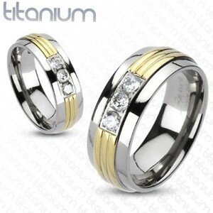 Titánium gyűrű - arany színű középső sáv, áttetsző cirkóniák - Nagyság: 51
